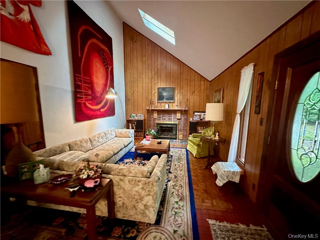 74 Swinging Bridge Estate Road Monticello, NY 12701 - Photo 11 of 36 a living room with furniture and a flat screen tv