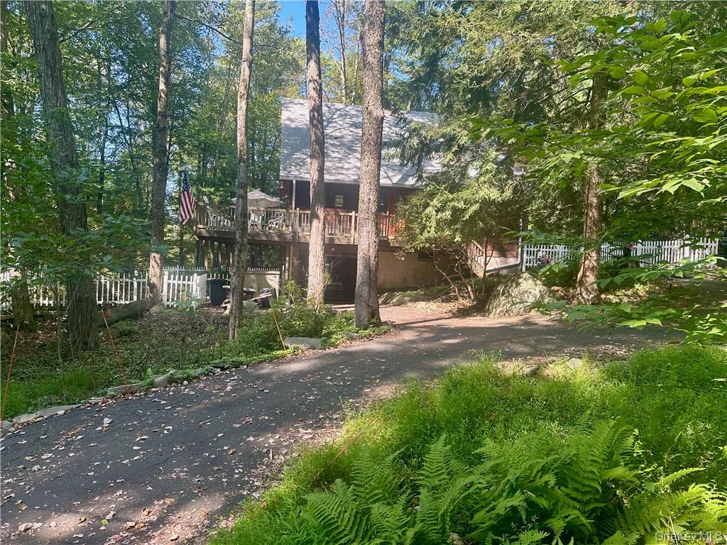 74 Swinging Bridge Estate Road Monticello, NY 12701 - Photo 2 of 36 a view of a city with tall trees