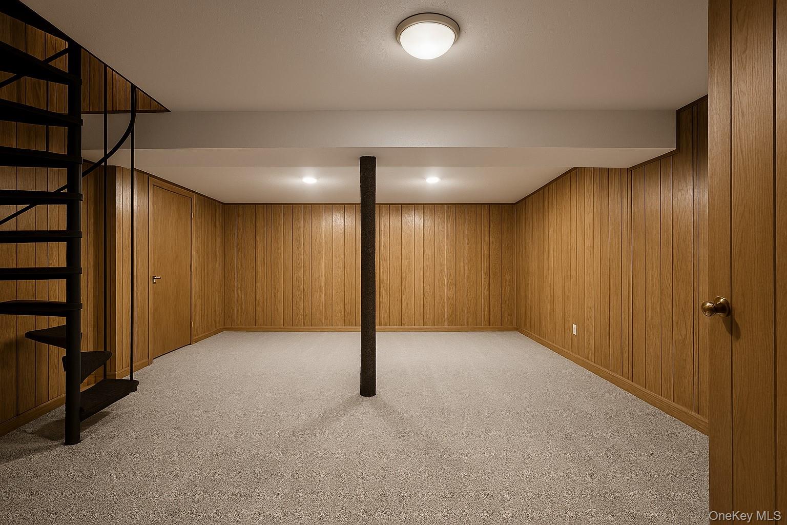 74 Swinging Bridge Estate Road Monticello, NY 12701 - Photo 29 of 36 Finished below grade area featuring stairs, light colored carpet, and wood walls