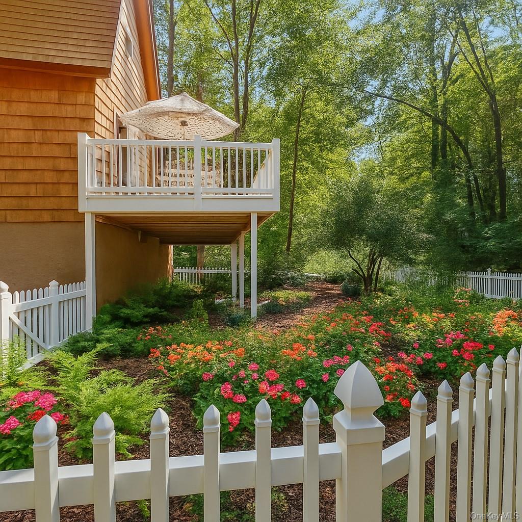 74 Swinging Bridge Estate Road Monticello, NY 12701 - Photo 6 of 36 a view of a house with wooden fence and a porch