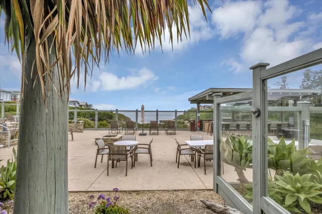 a view of a lake with houses in the back