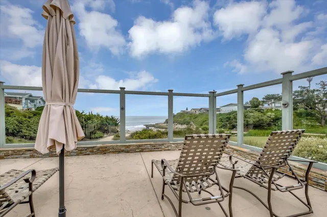 a view of a large building with beach in background