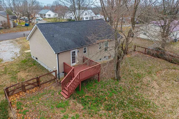 a aerial view of a house with a yard