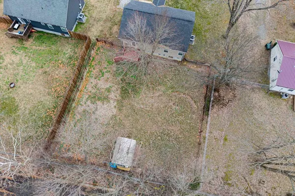 an aerial view of a house with outdoor space