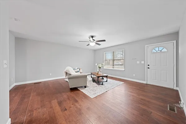 a living room with furniture and a table