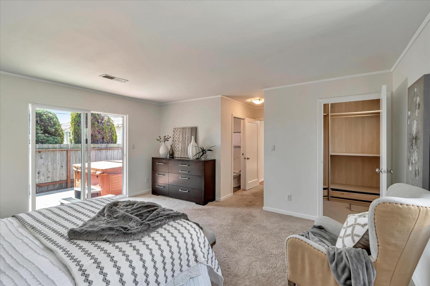 714 Cherry Avenue San Bruno, CA 94066 - Photo 17 of 29 a bedroom with a bed and a large window