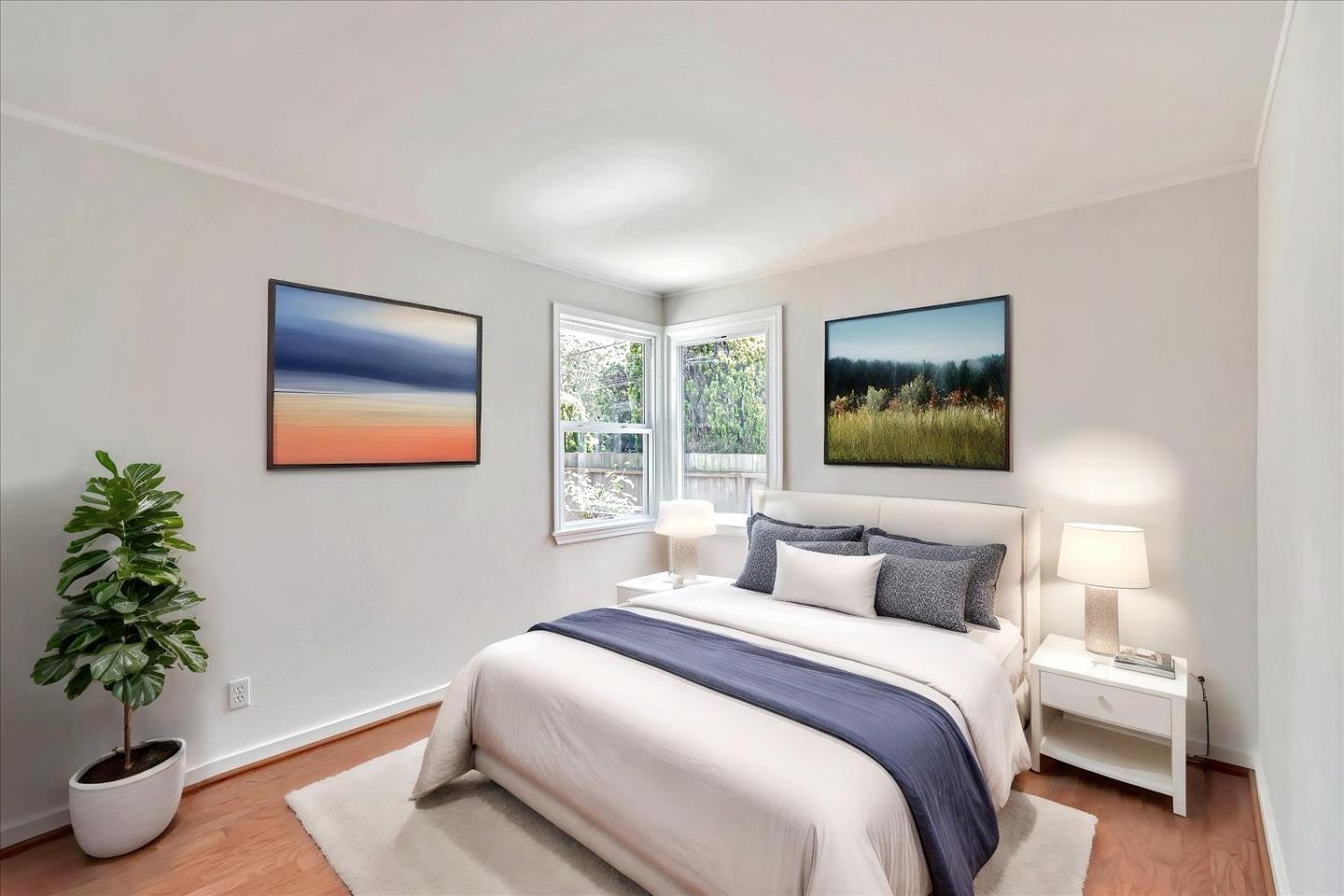 714 Cherry Avenue San Bruno, CA 94066 - Photo 20 of 29 a bedroom with a large bed and a potted plant