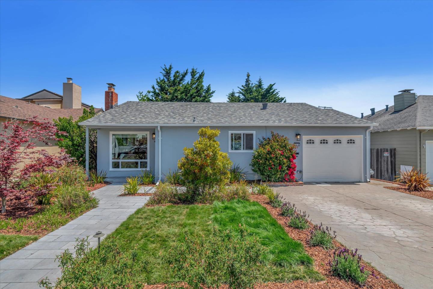 714 Cherry Avenue San Bruno, CA 94066 - Photo 2 of 29 a front view of a house with a yard and outdoor seating