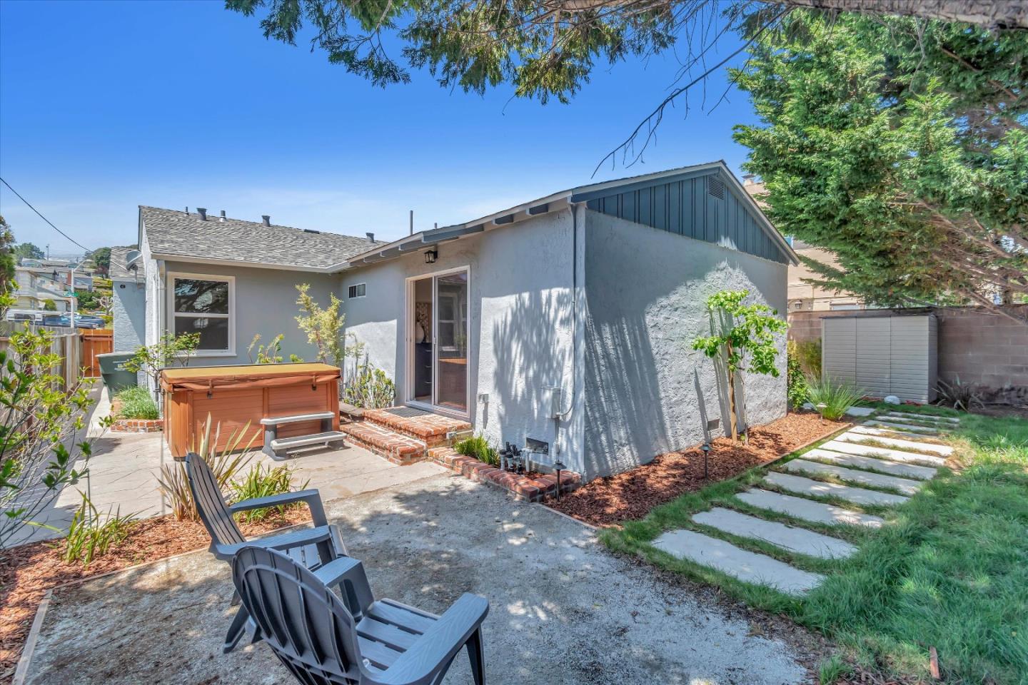 714 Cherry Avenue San Bruno, CA 94066 - Photo 22 of 29 a backyard of a house with barbeque oven table and chairs