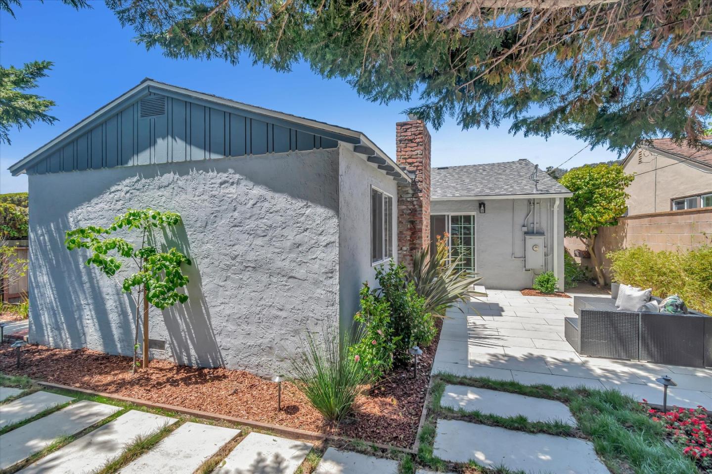 714 Cherry Avenue San Bruno, CA 94066 - Photo 24 of 29 a front view of a house with garden