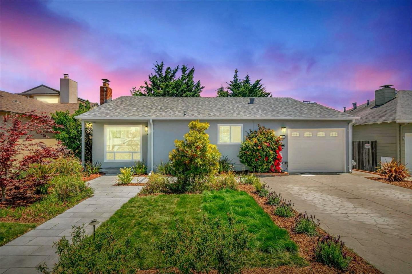 714 Cherry Avenue San Bruno, CA 94066 - Photo 27 of 29 a front view of a house with a yard and potted plants