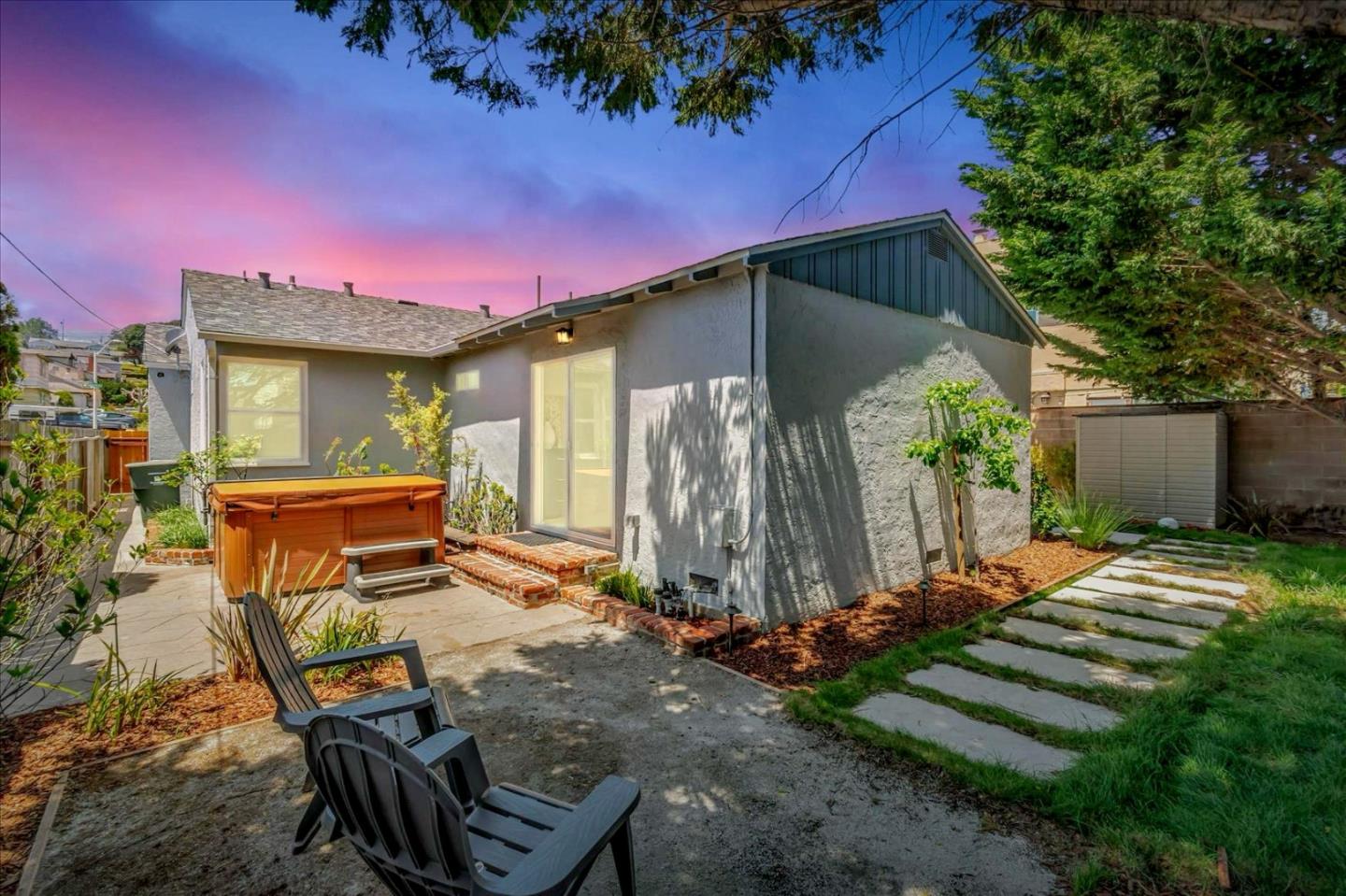 714 Cherry Avenue San Bruno, CA 94066 - Photo 28 of 29 a backyard of a house with barbeque oven table and chairs