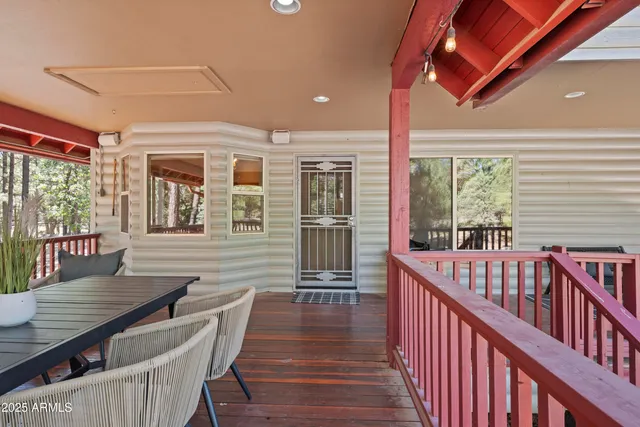 a view of a livingroom with workspace and a window