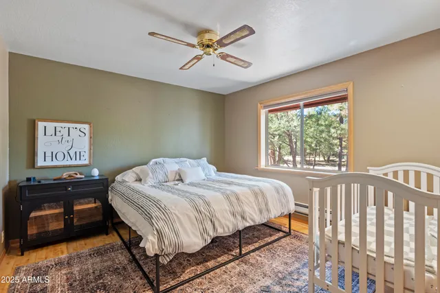 a bathroom with a sink and mirror with toilet