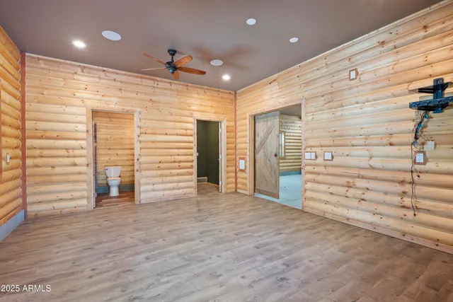 a view of a hallway with stairs and a window