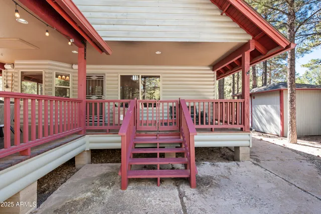 a view of a porch with wooden floor and outdoor space