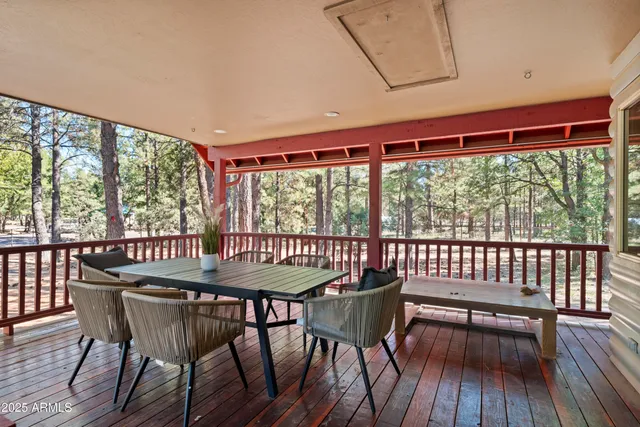 a view of a balcony with wooden floor