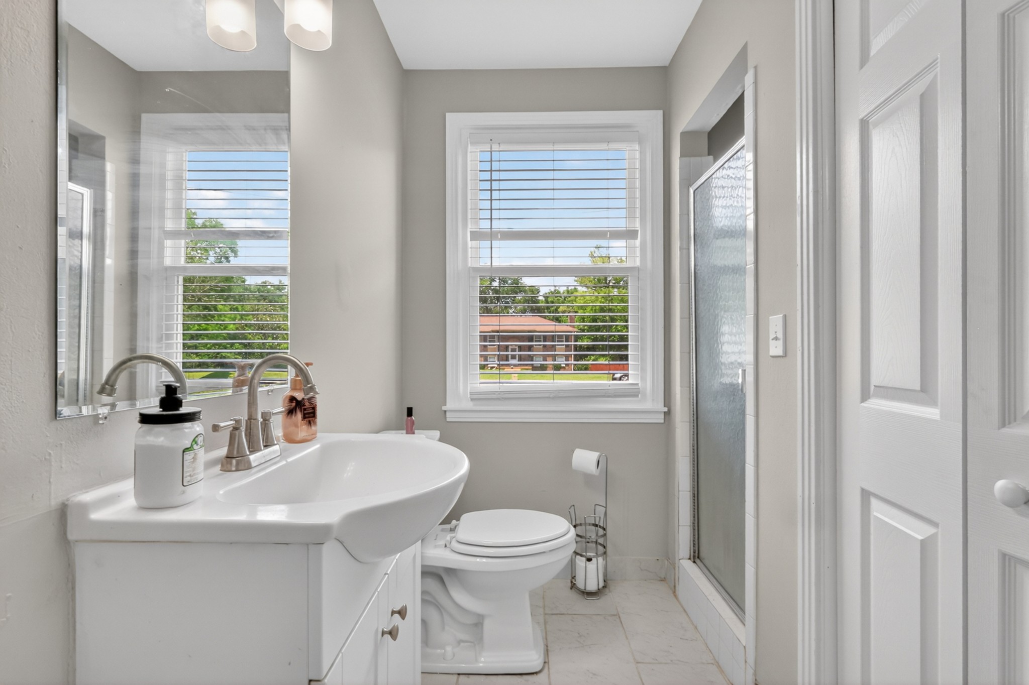 489 Canton Pass Madison, TN 37115 - Photo 22 of 25 a bathroom with a toilet a sink and a large mirror