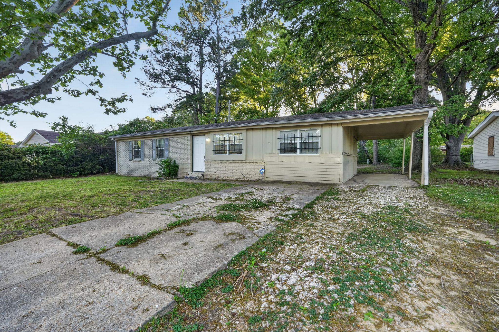 4504 Neely Road Memphis, TN 38109 - Photo 1 of 32 front view of house with a yard