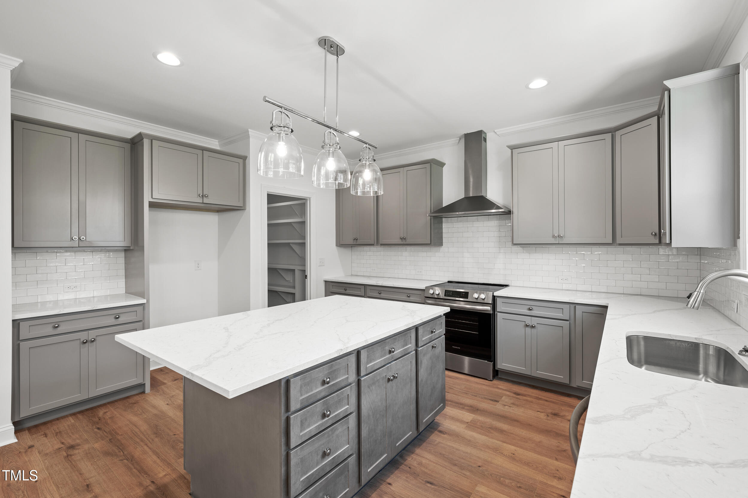 1693 Will Suitt Road Butner, NC 27522 - Photo 20 of 41 a kitchen with a sink stove and refrigerator