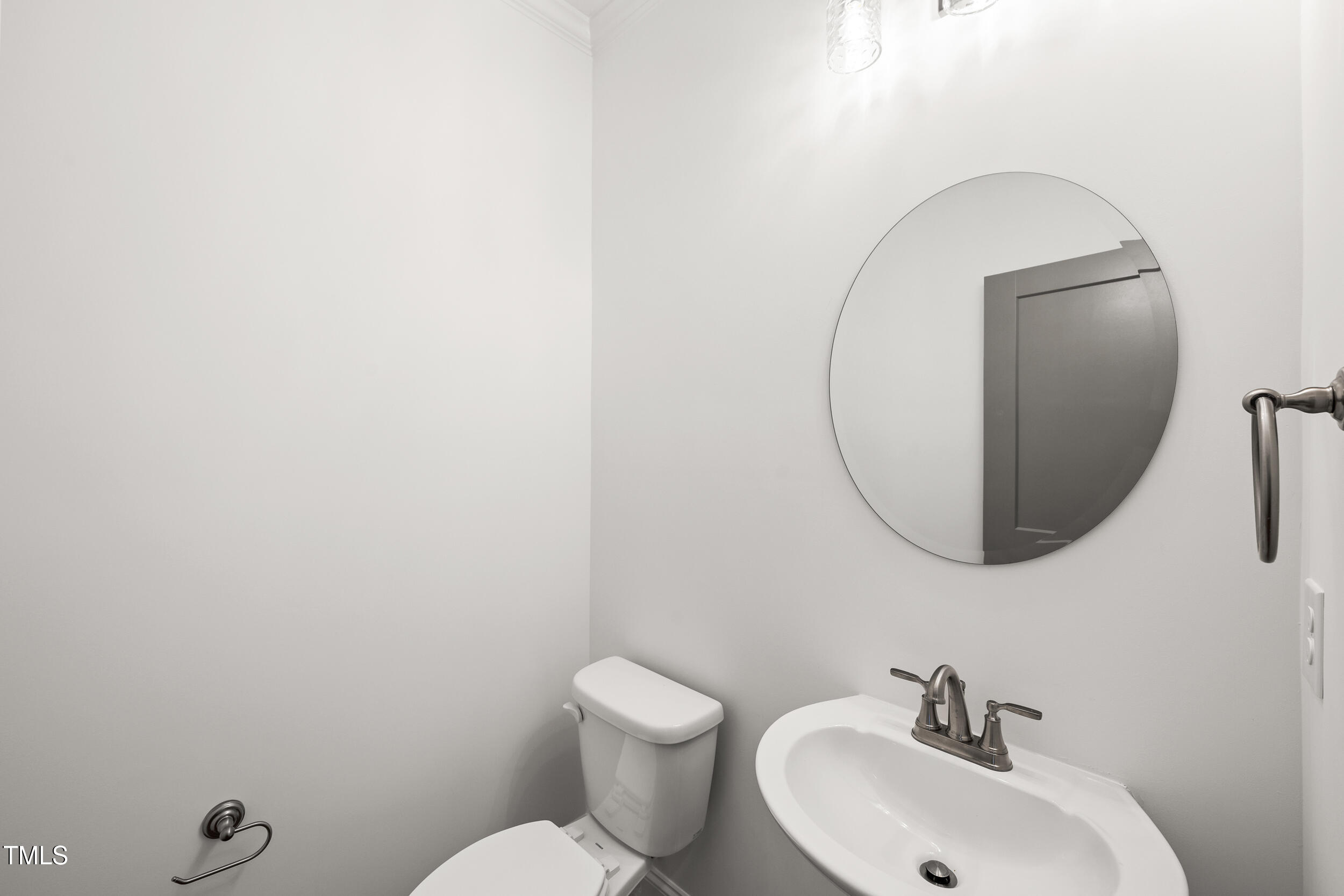 1693 Will Suitt Road Butner, NC 27522 - Photo 25 of 41 a bathroom with a sink mirror and toilet