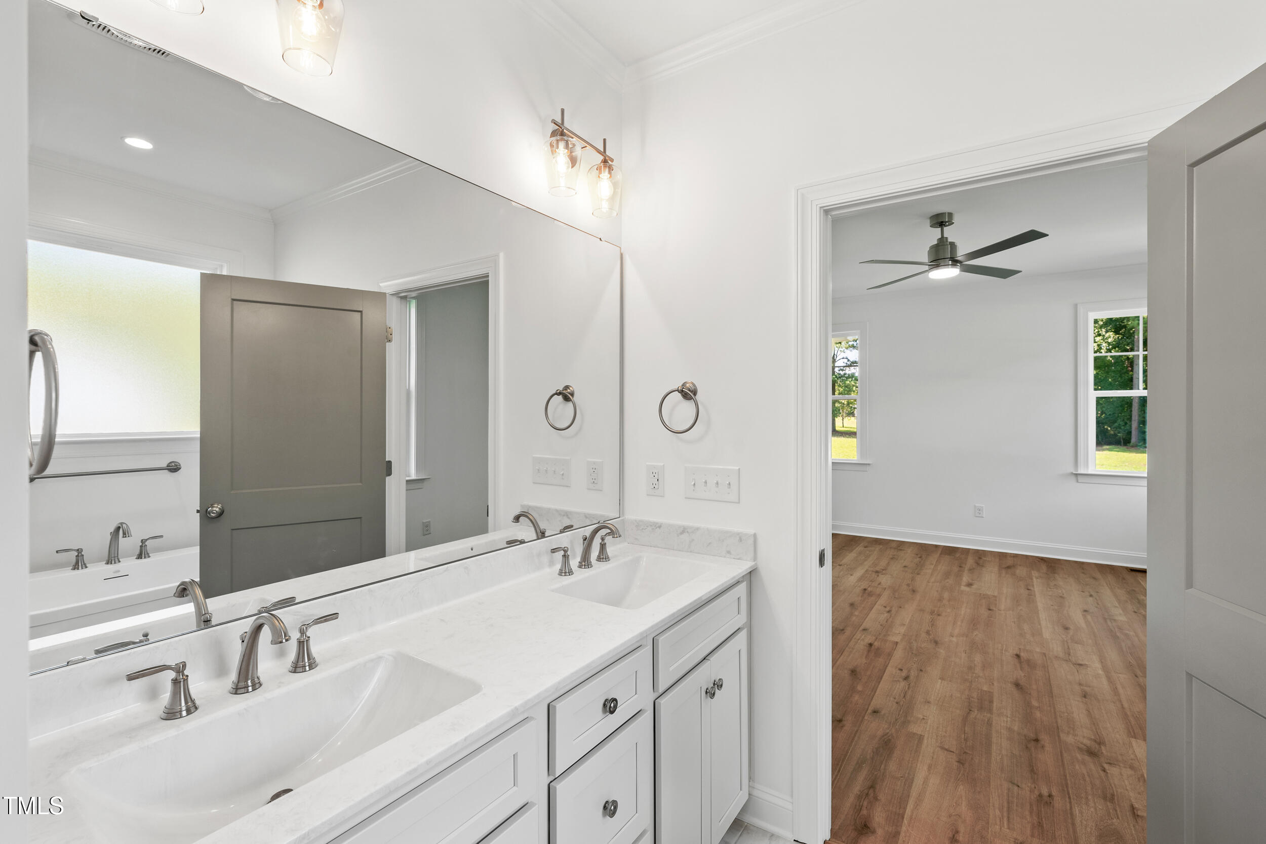1693 Will Suitt Road Butner, NC 27522 - Photo 32 of 41 a bathroom with a sink and a mirror