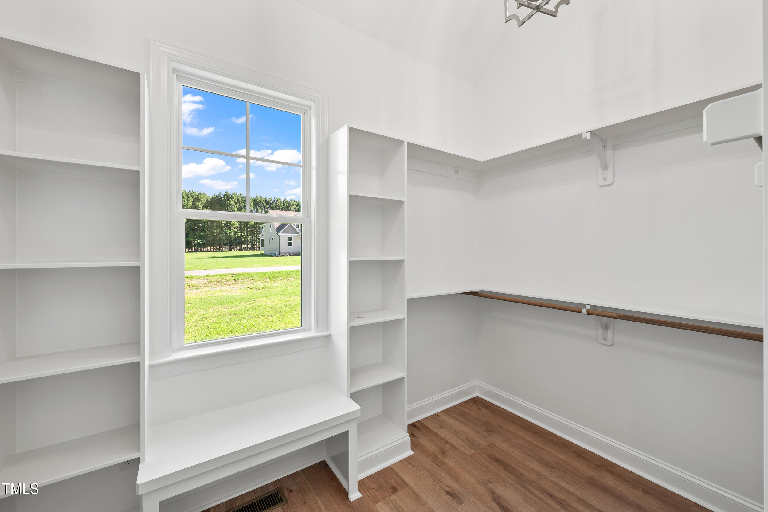 1693 Will Suitt Road Butner, NC 27522 - Photo 33 of 41 a view of an empty room with a window and wooden floor