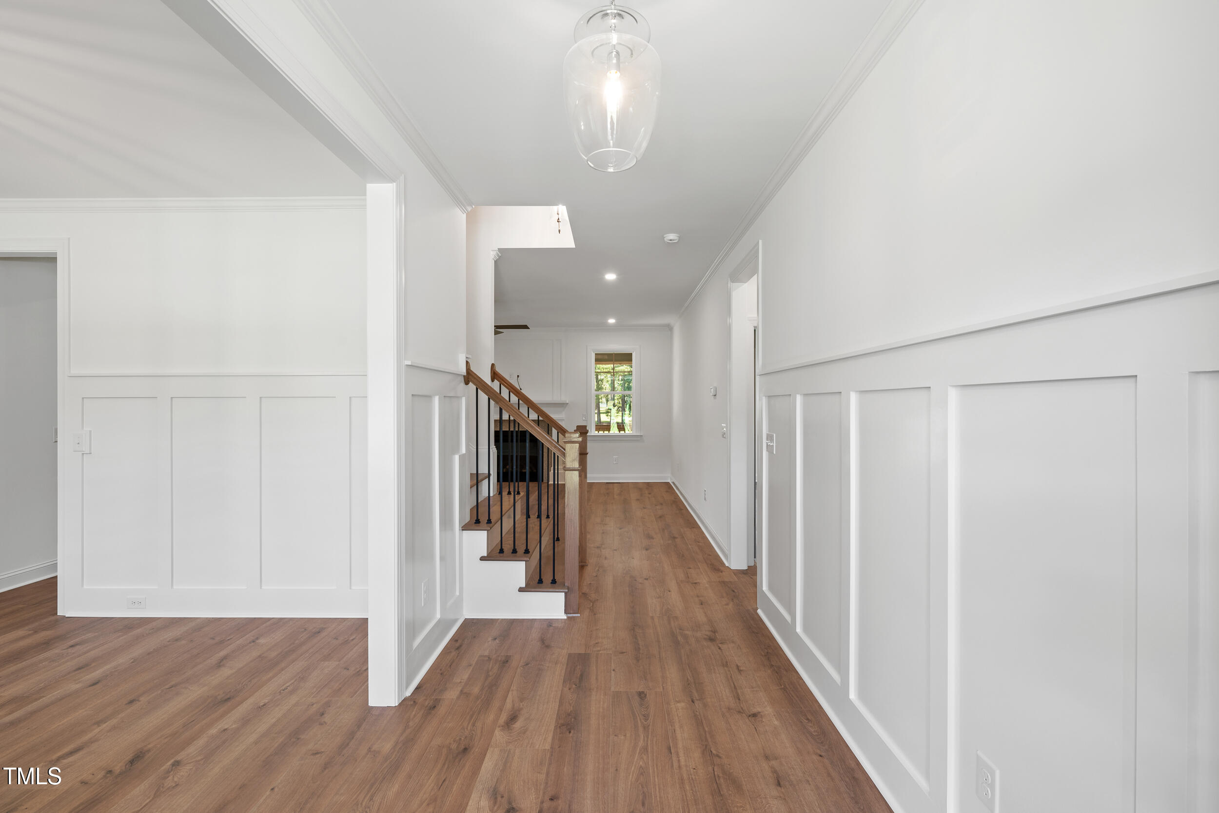 1693 Will Suitt Road Butner, NC 27522 - Photo 9 of 41 a hallway and a hallway with wooden floor