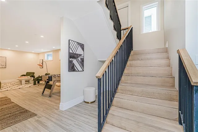 a view of entryway and hall with wooden floor