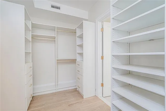 a view of an empty walk in closet