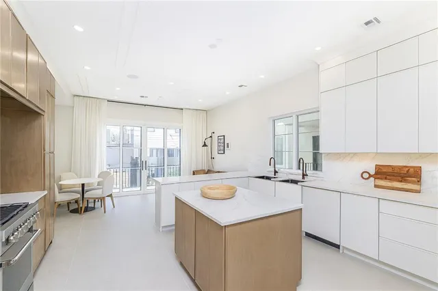 a kitchen that has a sink and a stove in it