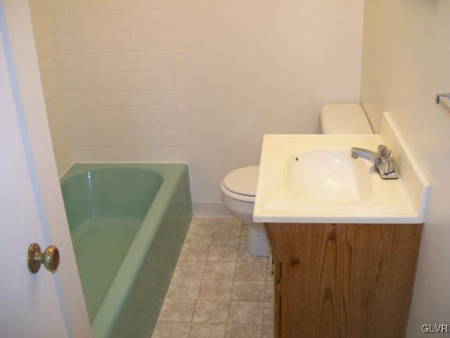 4788 Chapmans Road Allentown, PA 18104 - Photo 5 of 8 a bathroom with a sink and toilet