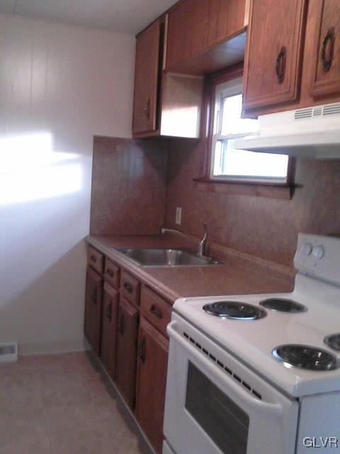 4788 Chapmans Road Allentown, PA 18104 - Photo 8 of 8 a kitchen with a stove and a sink
