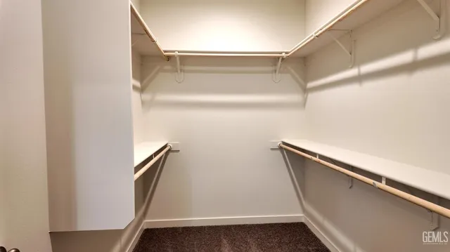 a picture of a bench in front of a wall