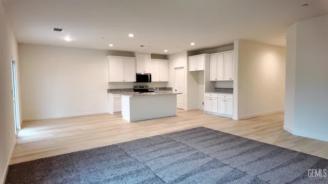 a view of kitchen with wooden floor