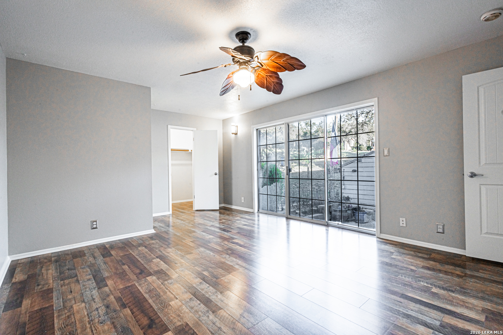 14 Oak Villa Road, Unit G5 Canyon Lake, TX 78133 - Photo 14 of 27 a view of a room with wooden floor and fan