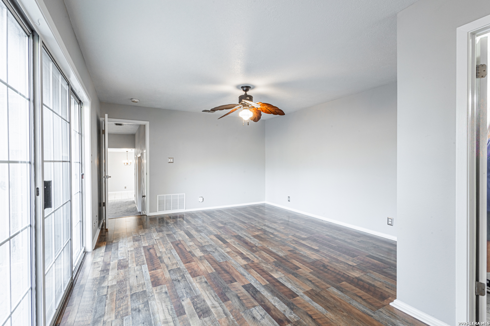 14 Oak Villa Road, Unit G5 Canyon Lake, TX 78133 - Photo 16 of 27 a view of empty room with wooden floor and fan