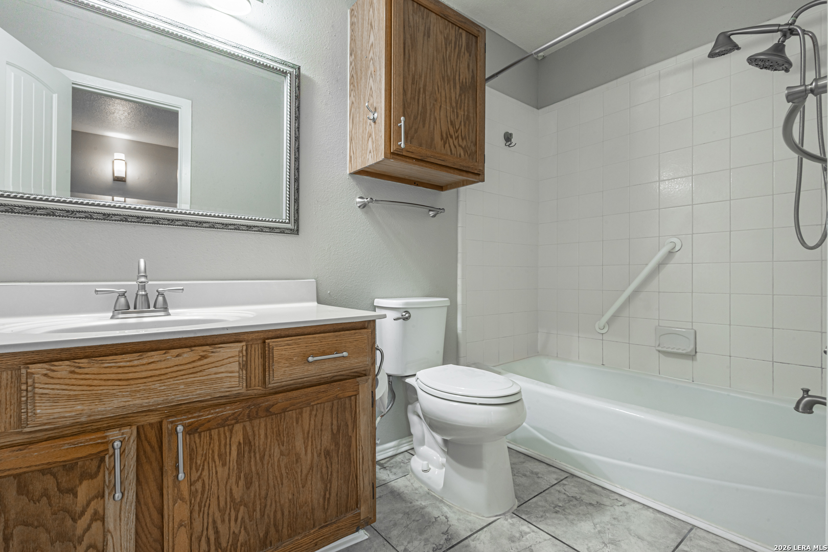 14 Oak Villa Road, Unit G5 Canyon Lake, TX 78133 - Photo 18 of 27 a bathroom with a sink a toilet and bathtub