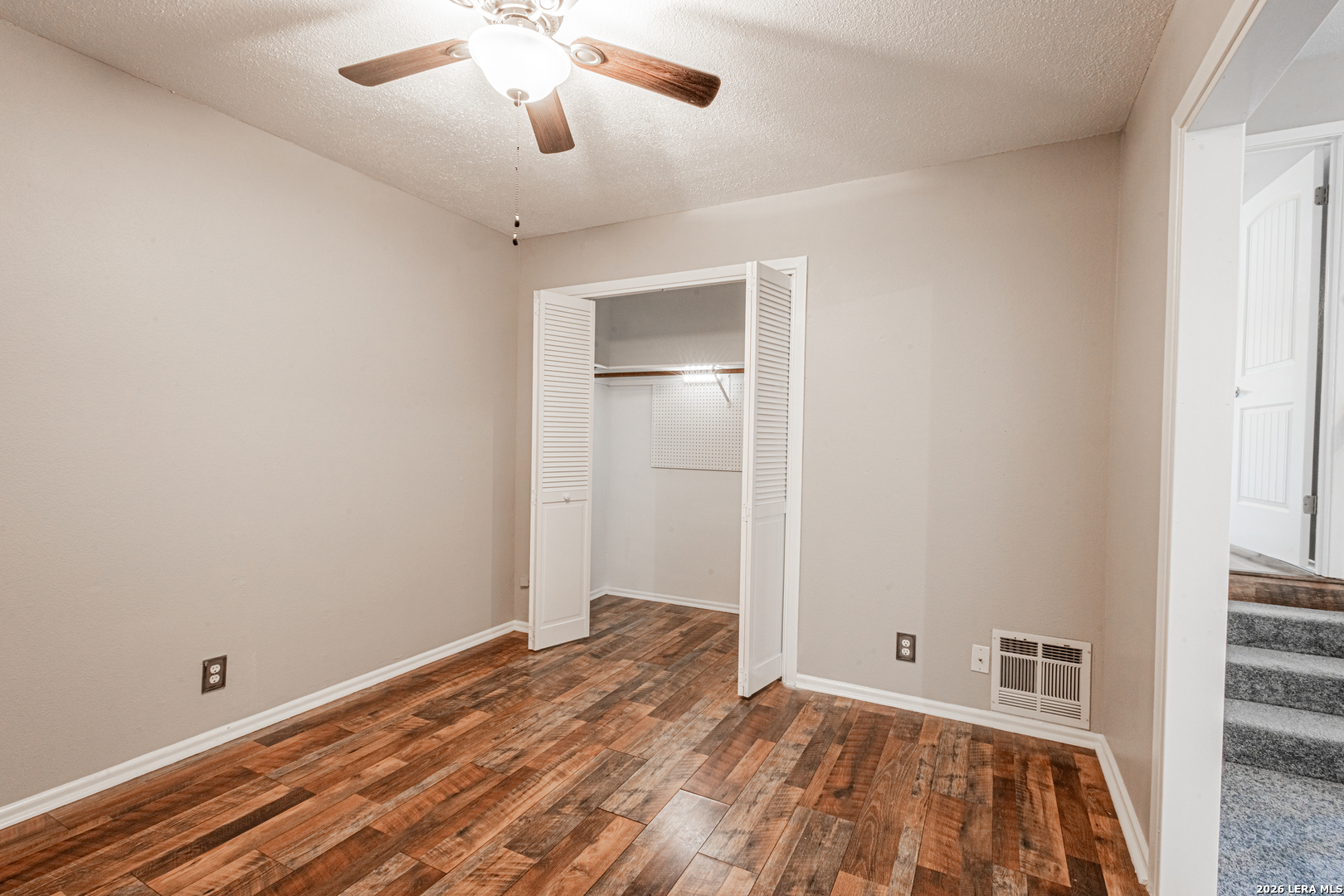 14 Oak Villa Road, Unit G5 Canyon Lake, TX 78133 - Photo 19 of 27 a view of empty room with wooden floor