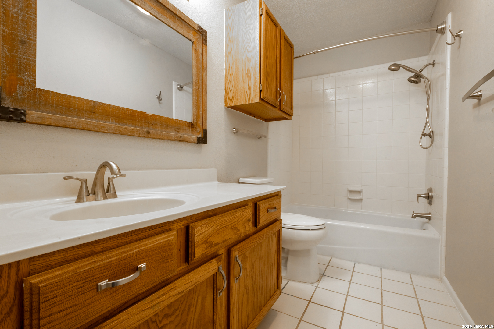 14 Oak Villa Road, Unit G5 Canyon Lake, TX 78133 - Photo 20 of 27 a bathroom with a sink a toilet and shower