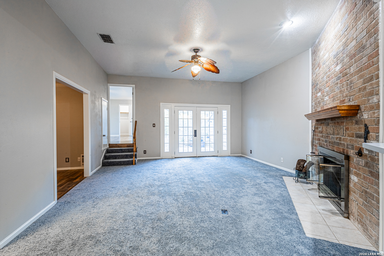 14 Oak Villa Road, Unit G5 Canyon Lake, TX 78133 - Photo 8 of 27 an empty room with windows and fireplace