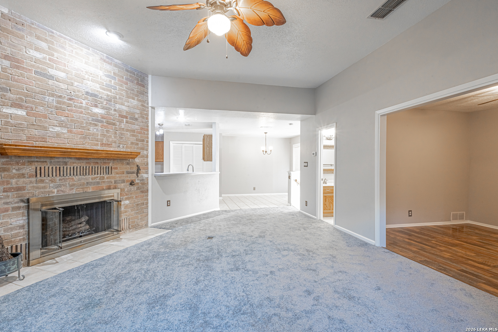 14 Oak Villa Road, Unit G5 Canyon Lake, TX 78133 - Photo 10 of 27 a view of an empty room with a fireplace and a window