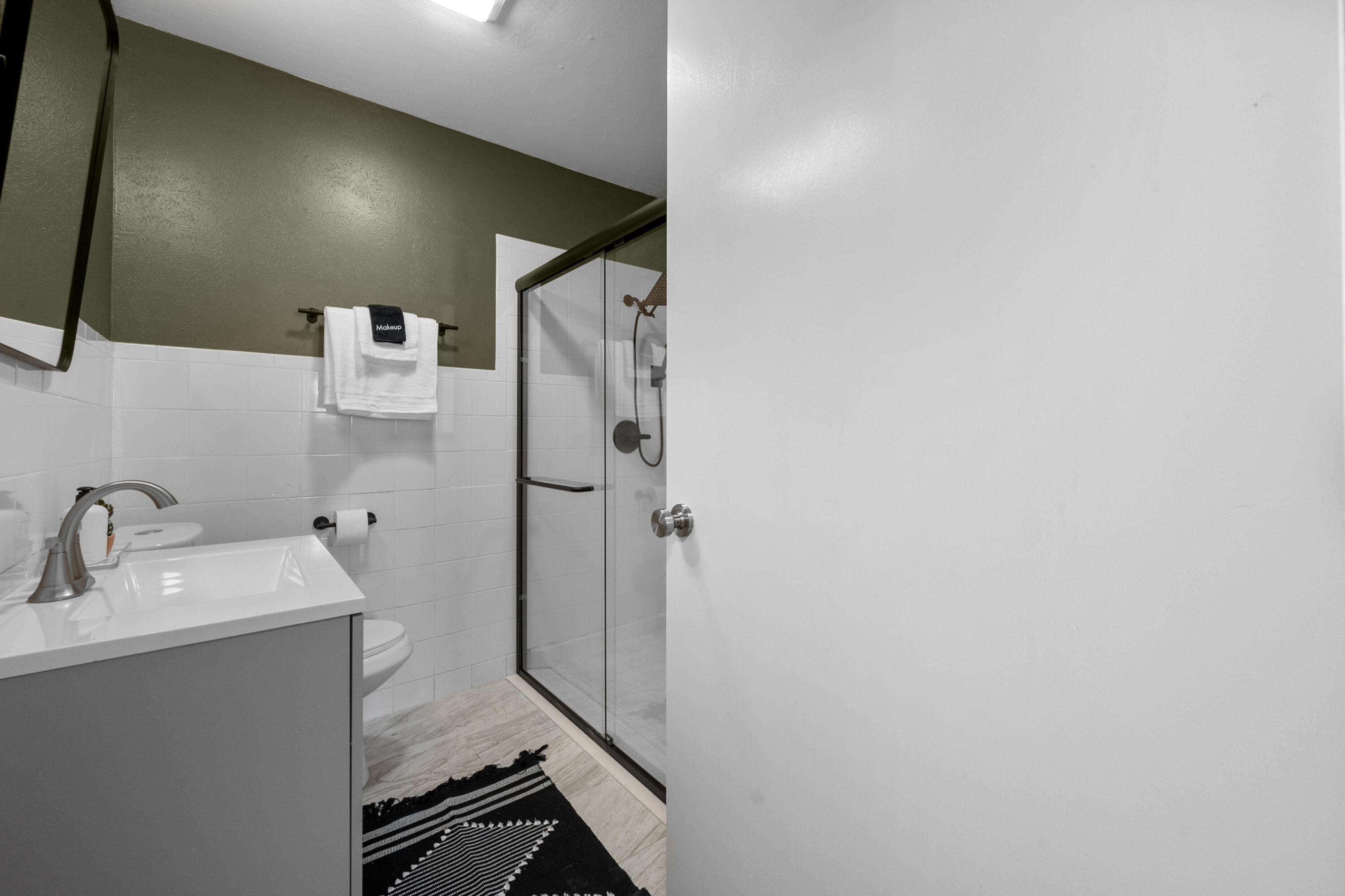 5421 43rd Street Lubbock, TX 79414 - Photo 11 of 40 a bathroom with a sink and a mirror