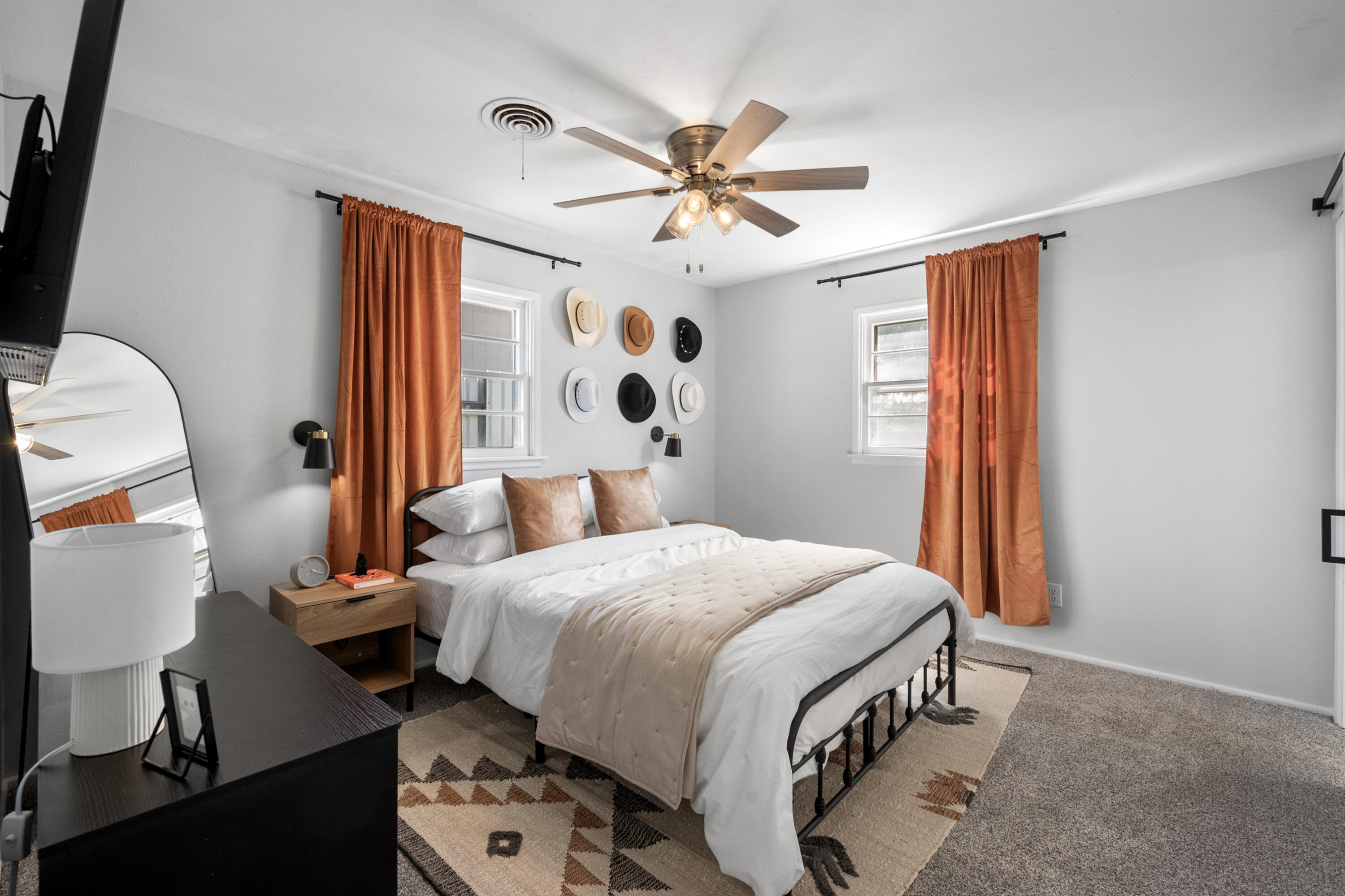 5421 43rd Street Lubbock, TX 79414 - Photo 15 of 40 a bedroom with a bed and a chandelier