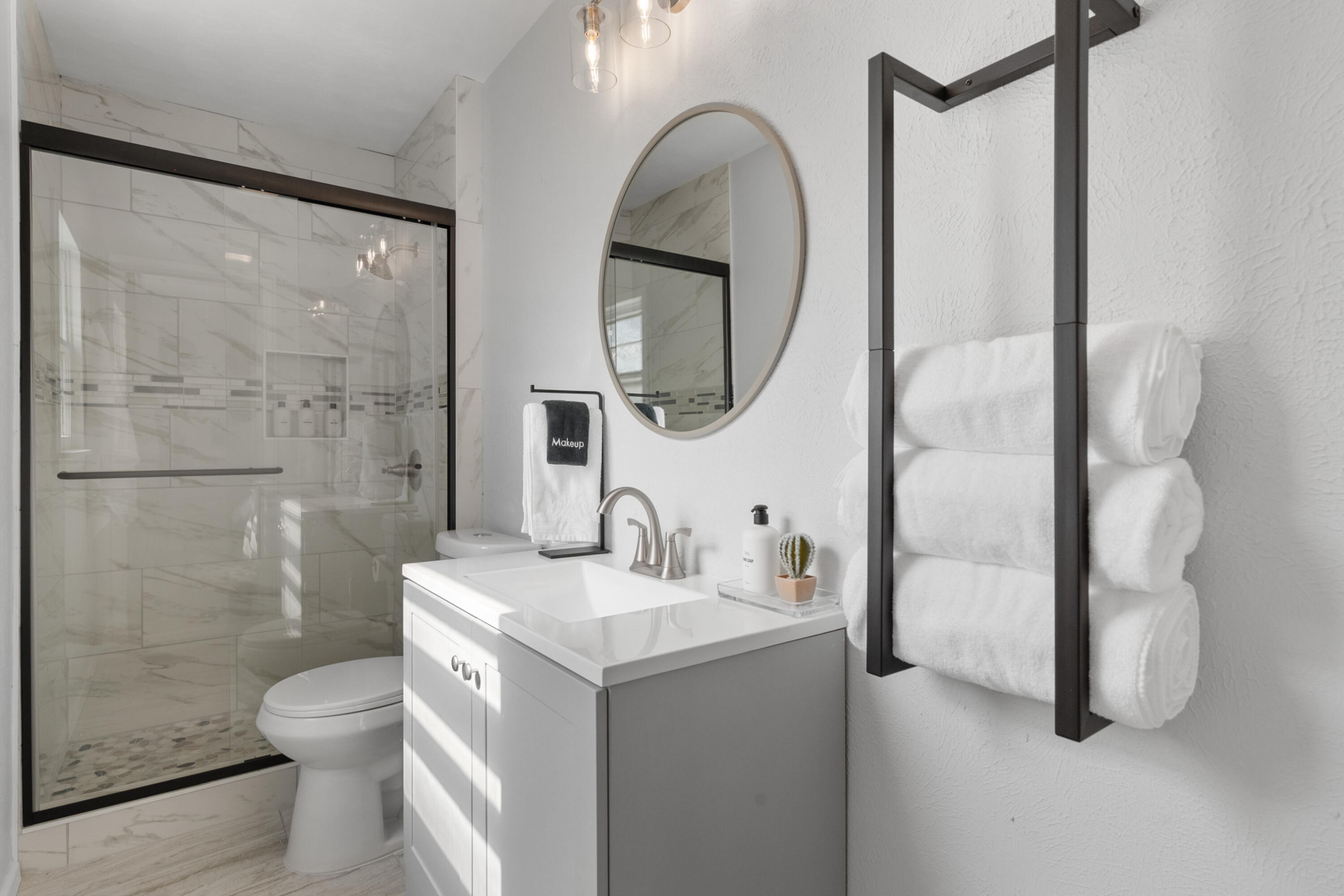 5421 43rd Street Lubbock, TX 79414 - Photo 20 of 40 a bathroom with a toilet sink and shower