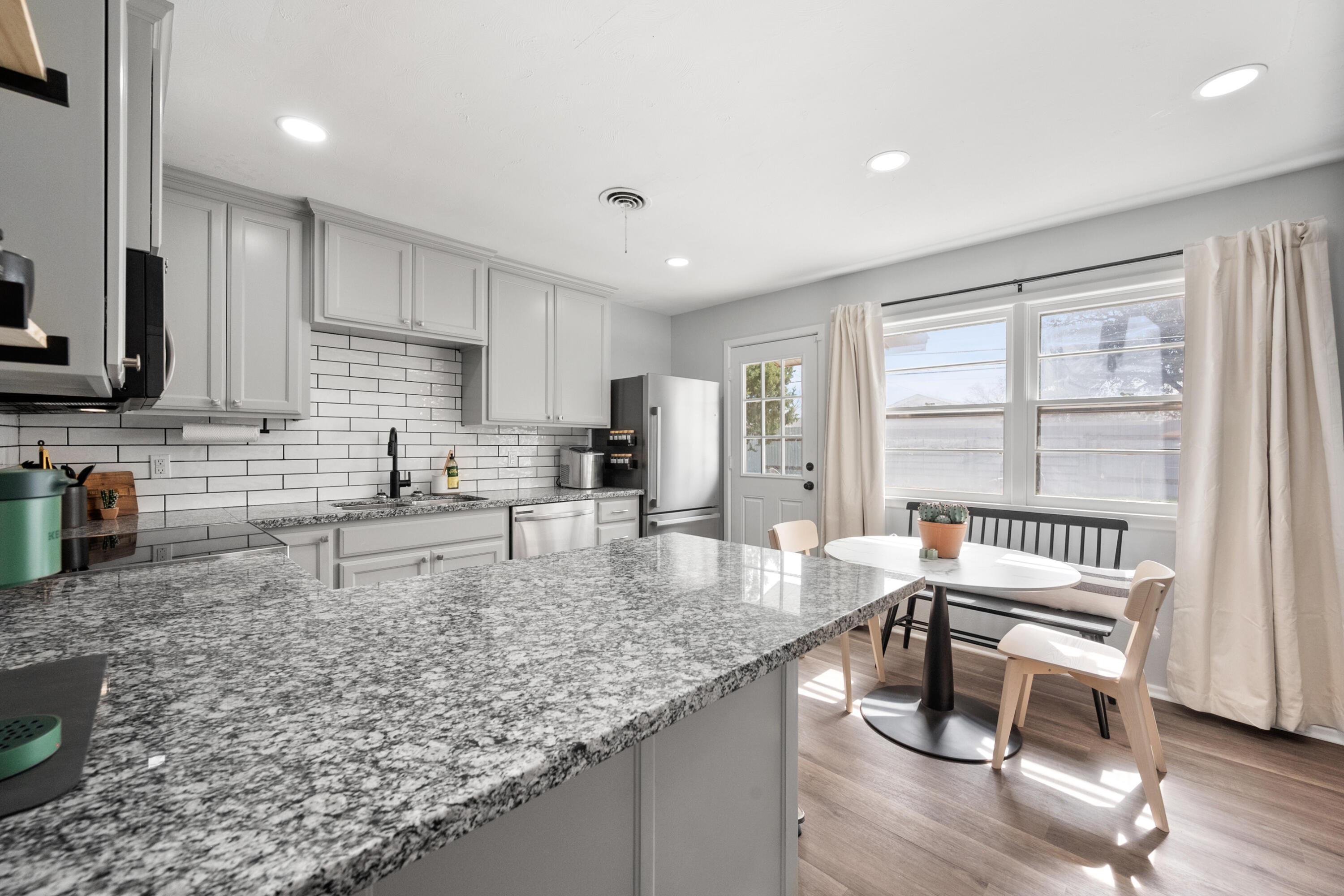 5421 43rd Street Lubbock, TX 79414 - Photo 23 of 40 a kitchen with granite countertop lots of counter top space and furniture