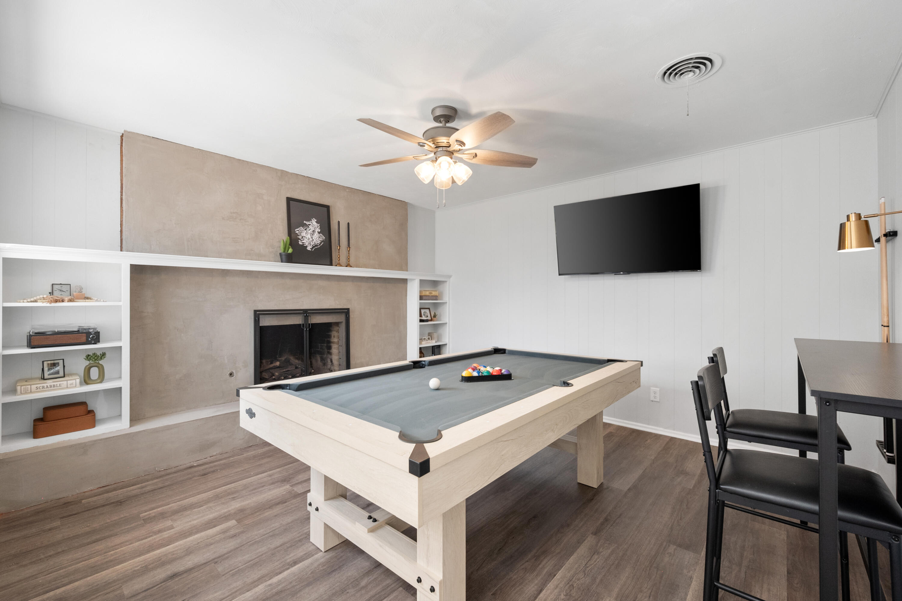 5421 43rd Street Lubbock, TX 79414 - Photo 31 of 40 a living room with furniture and a flat screen tv