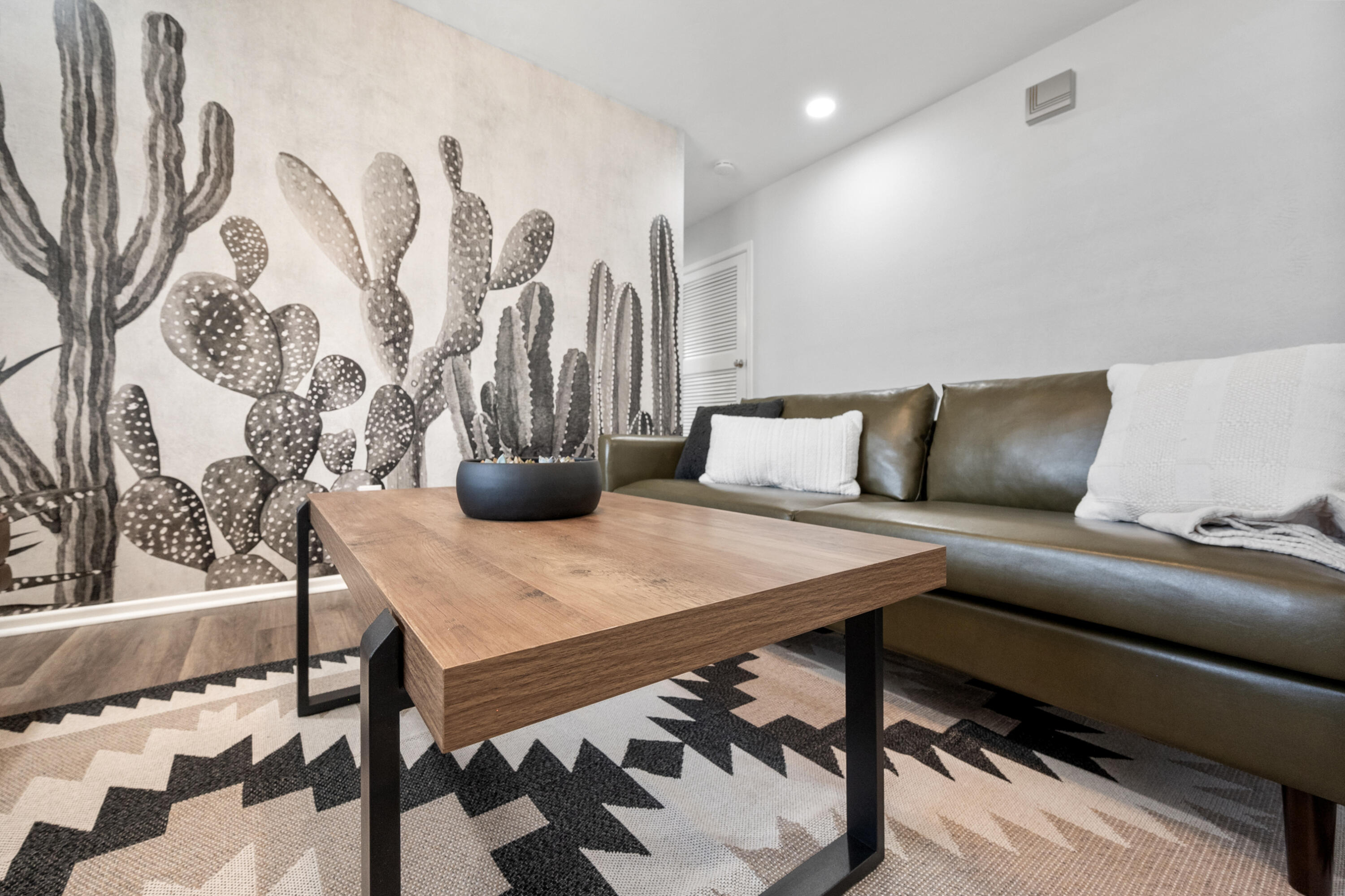 5421 43rd Street Lubbock, TX 79414 - Photo 9 of 40 a living room with furniture and a painting on the wall