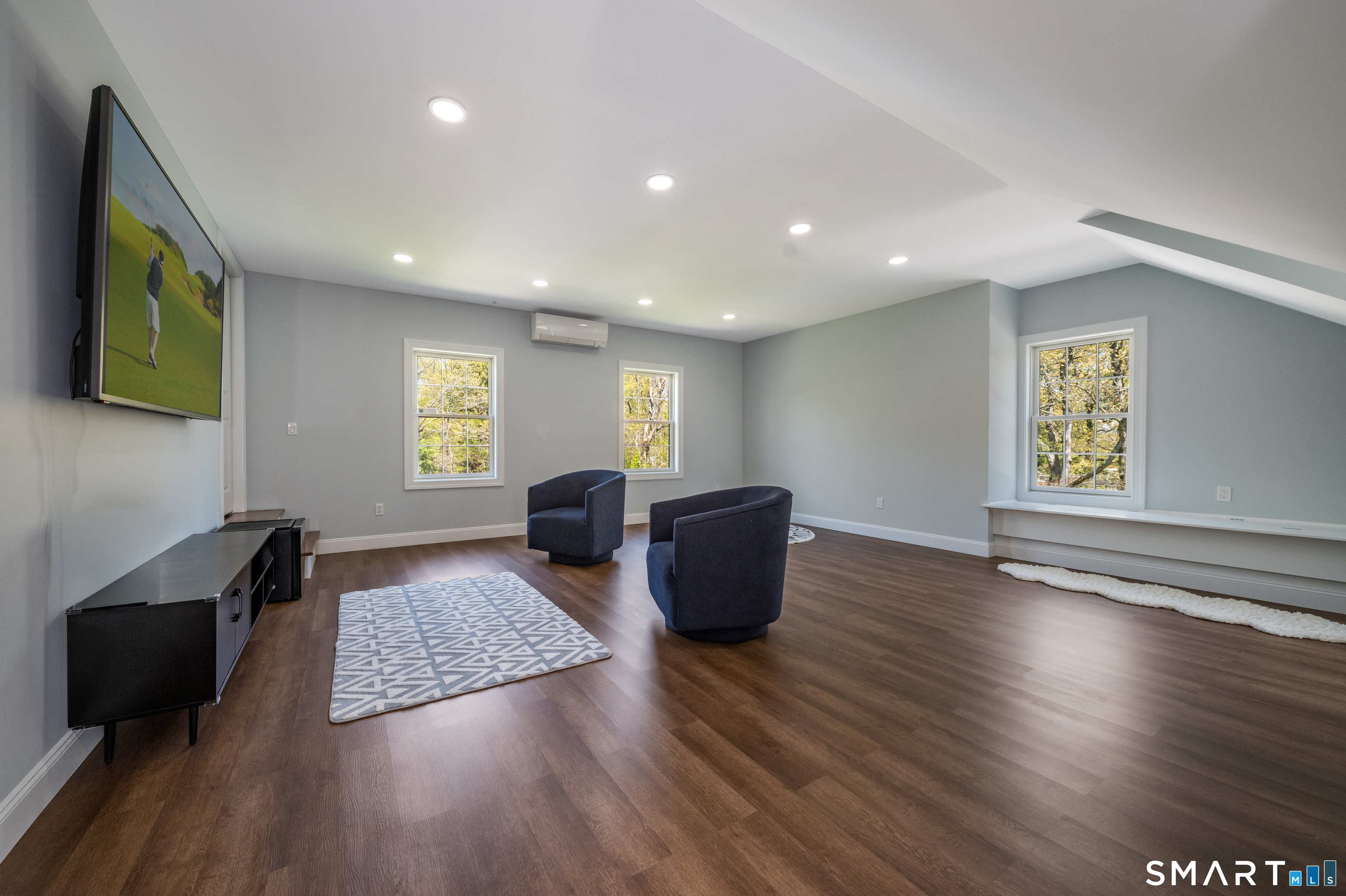 9 Sunset Ridge Drive Guilford, CT 06437 - Photo 30 of 40 a living room with couch wooden floor and a window