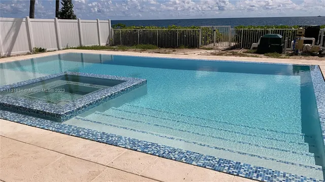 a view of a living room and kitchen